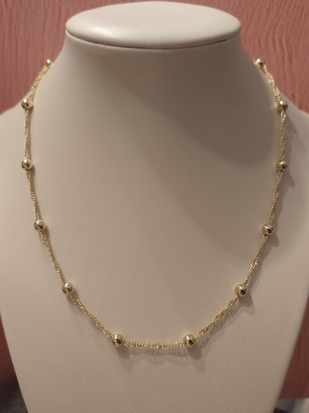 The surface is plated with a thin layer of real gold 14k. 17" 1/2